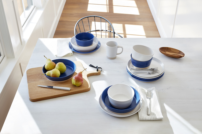 Different size bowls, cups, and other pieces from the Gap Home collection sit on a tabletop.